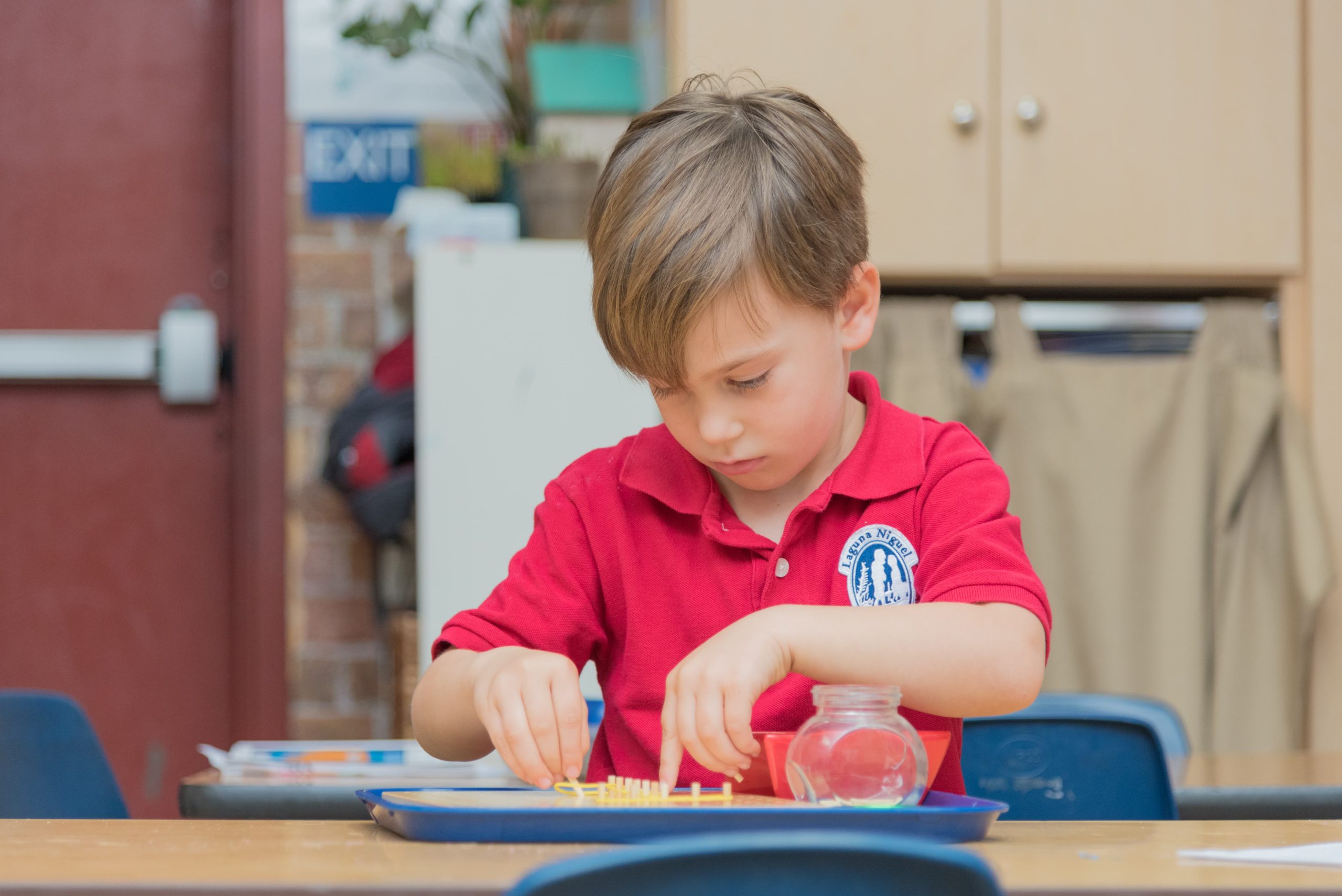 students creating artwork with Montessori open-ended materials